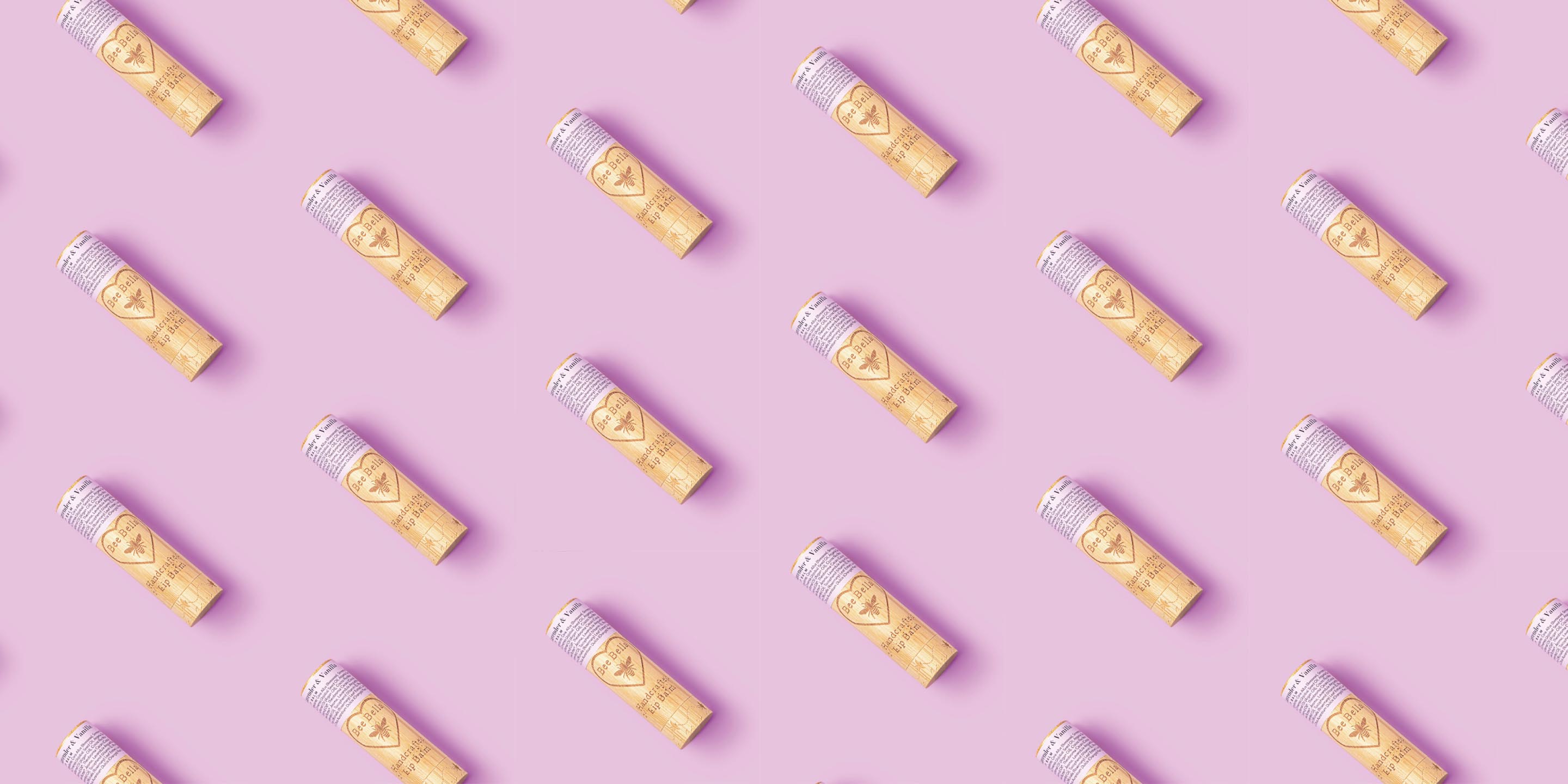 Bee Bella natural lip balm photographed with floating fresh mint leaves 1