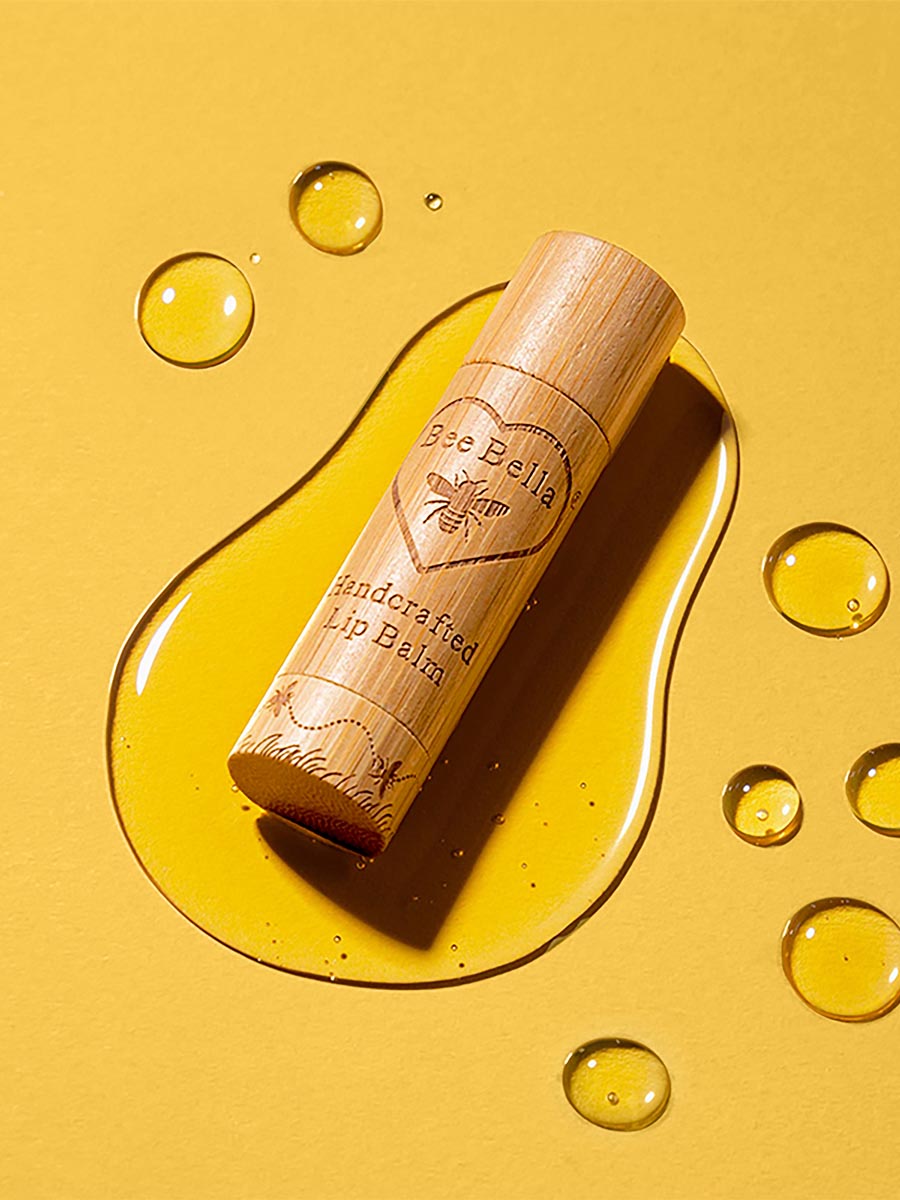 Lip balm product photograph with ingredient-led styling and advanced retouching 9