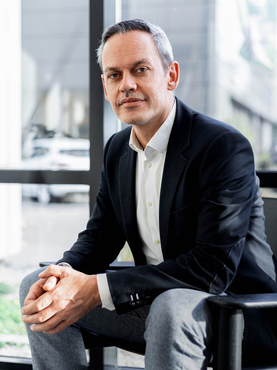 professional headshot showing consistent framing across employee portrait series 12