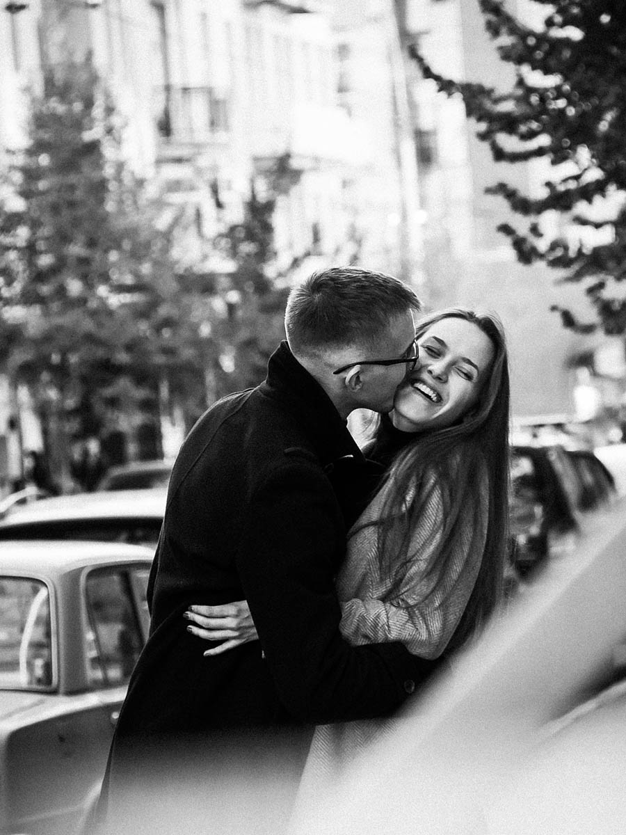 Candid couple laughing together during an outdoor portrait session 2