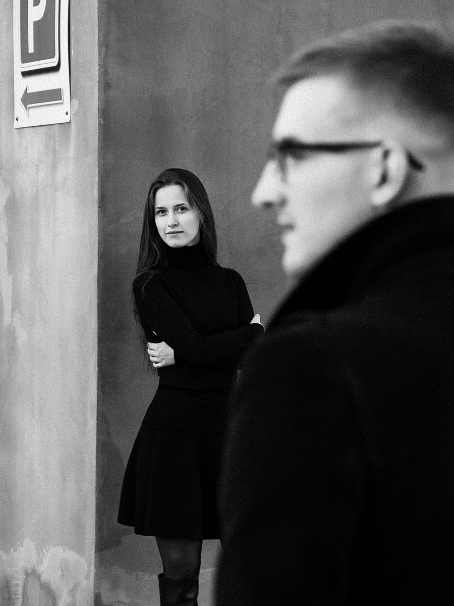 Creative black and white couple portrait framed by city architecture 3