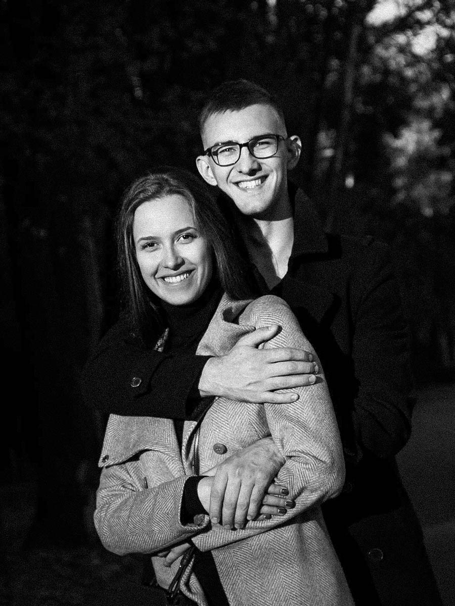 Black and white editorial portrait of a couple embracing in an urban setting 11