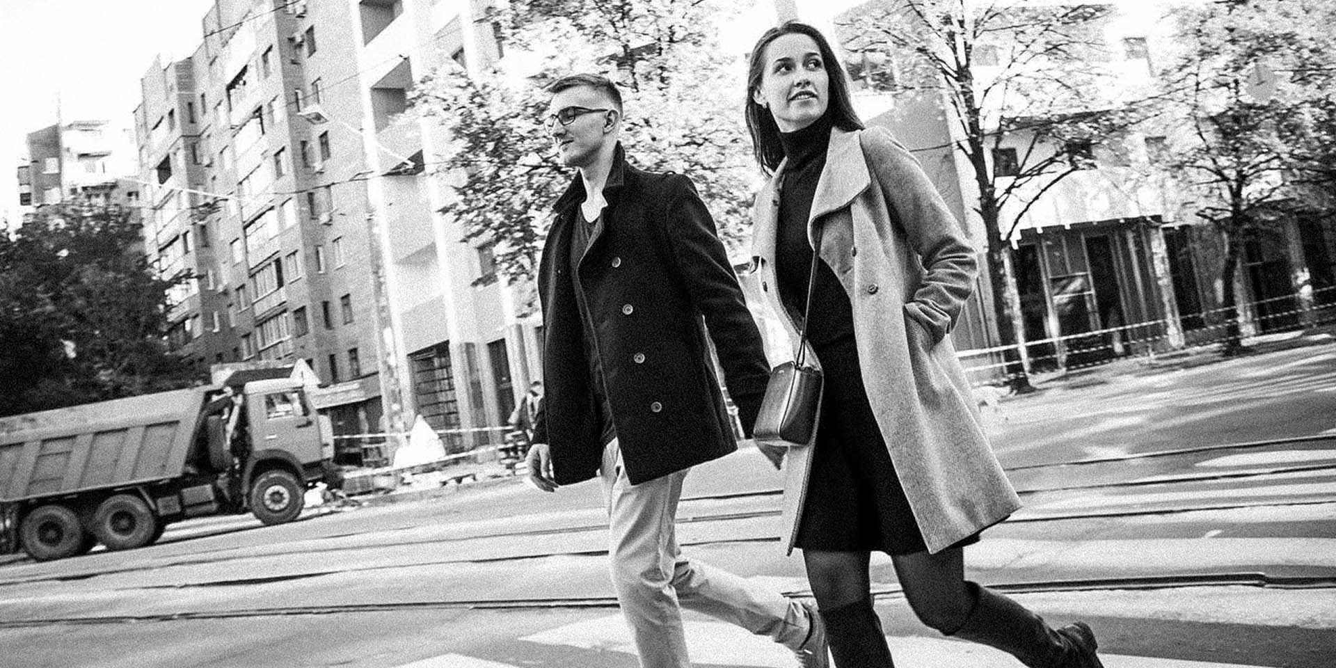 Creative black and white couple portrait framed by city architecture 13
