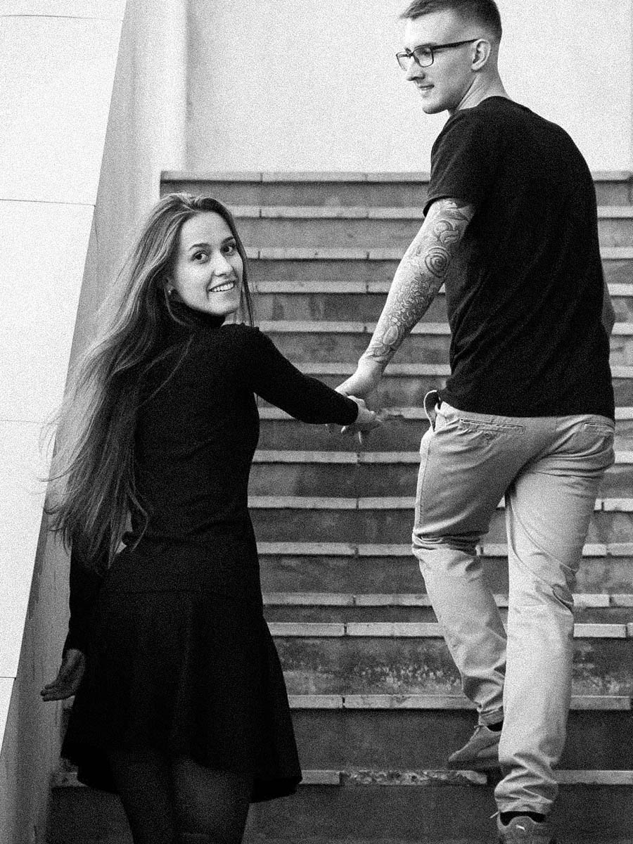 Candid couple laughing together during an outdoor portrait session 12
