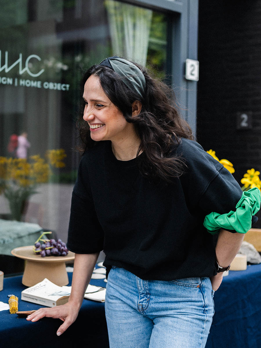 Artisan presenting handmade ceramics during an Eindhoven pop-up event 13