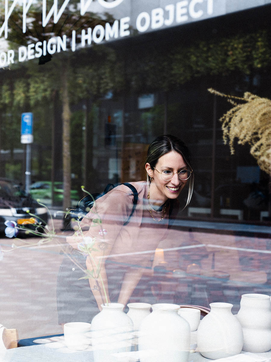 Visitors examining handmade objects at a creative business event in Eindhoven 16
