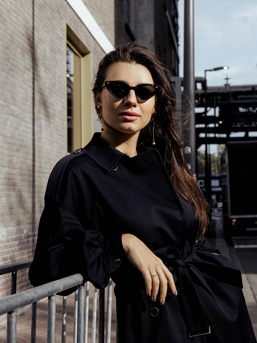 Female model photographed against modern building lines in Maastricht 15