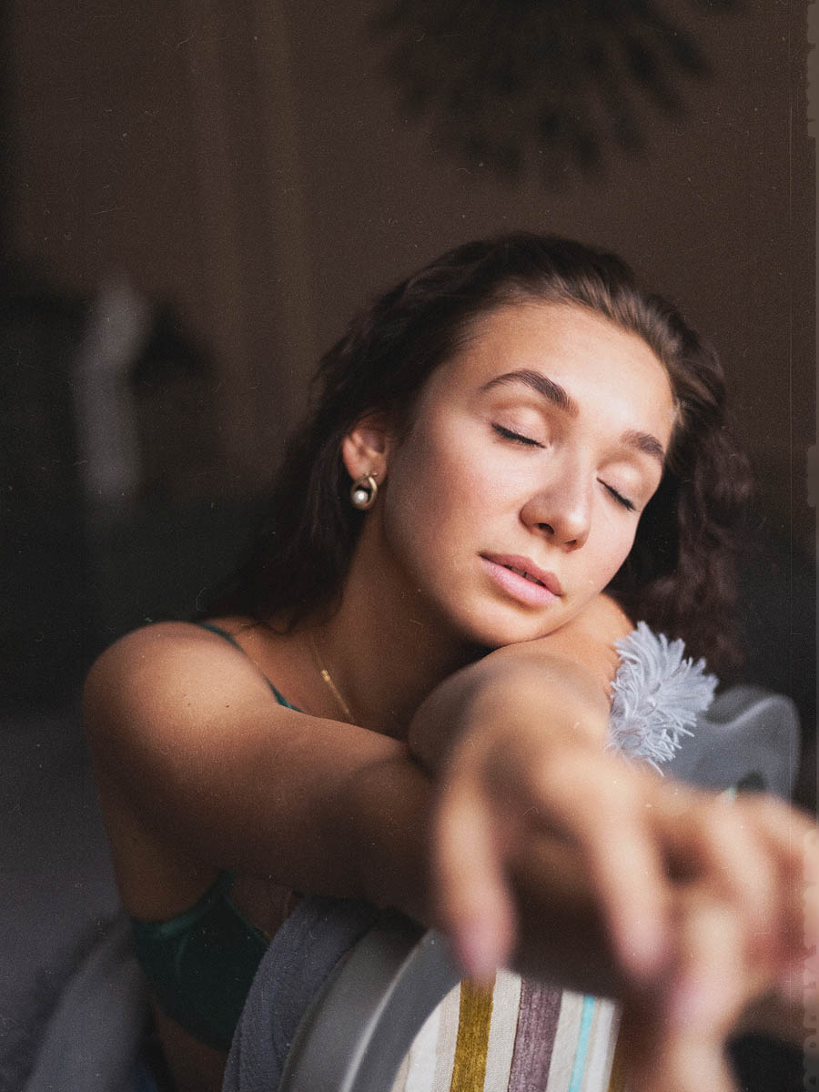 Expressive female portrait with soft lighting and spring floral details 9